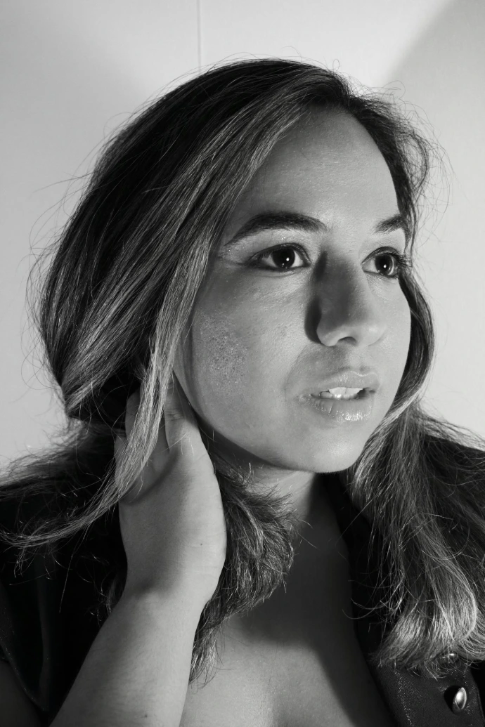 a black and white photo of a woman posing for a picture